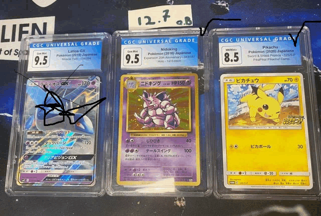 three pokemon cards are displayed in clear plastic cases with one of them being nidoring