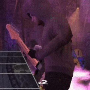 a video game screen shows a man playing a guitar and the number 2 on the bottom