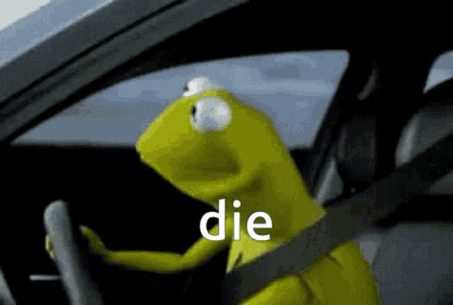 kermit the frog is driving a car with the word die written on the screen .