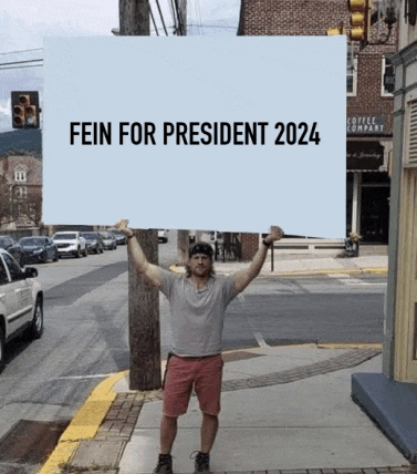 a man holds a sign that says fein for president 2024