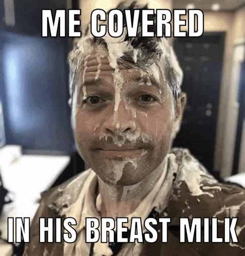 a man with a lot of milk on his face and the words me covered in his breast milk