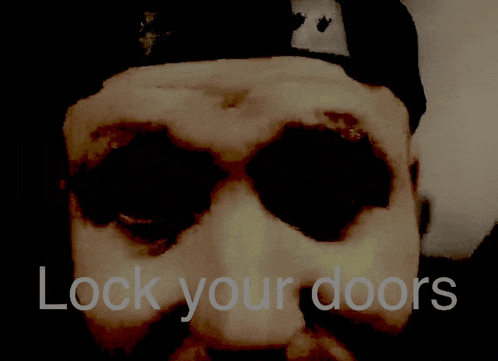 a close up of a man 's face with the words " lock your doors " below it