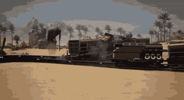 a train is going down a track in the desert with a statue in the background