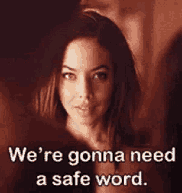 a woman is standing in front of a man and saying `` we 're gonna need a safe word . ''