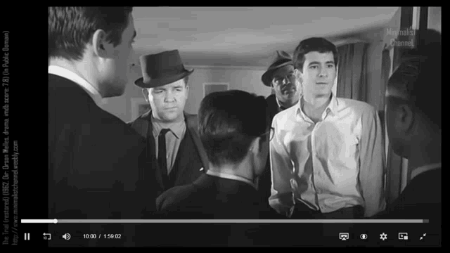 a group of men are standing in a room and the time of the video is 19:00