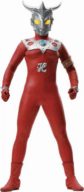 a man in a red suit with the letter k on his chest is standing in front of a white background