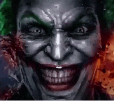 a close up of a joker 's face with a huge smile on it .