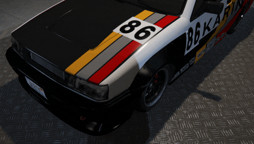 a black and white car with the number 86 on it