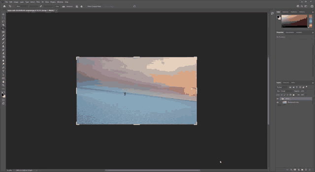 a computer screen with a picture of a beach and a sunset in the background