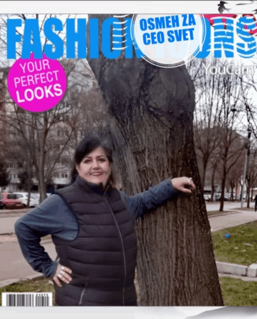 a woman is standing next to a tree on the cover of a magazine