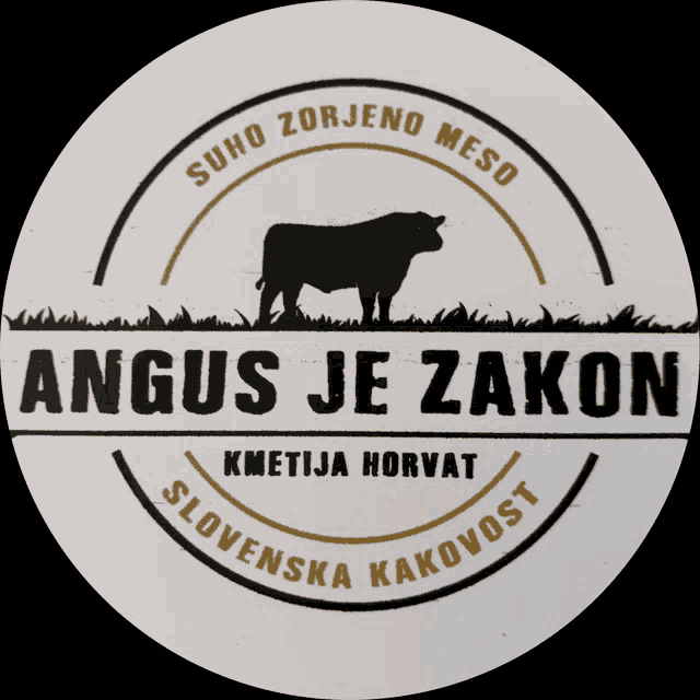 a logo for angus je zakon with a cow in the grass