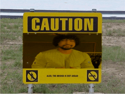 a caution sign with a picture of a man in a yellow jacket