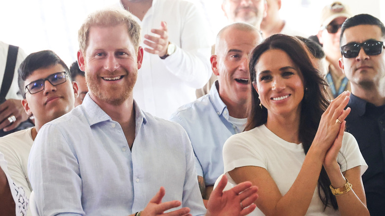 Prince Harry and Meghan Markle seated at an event