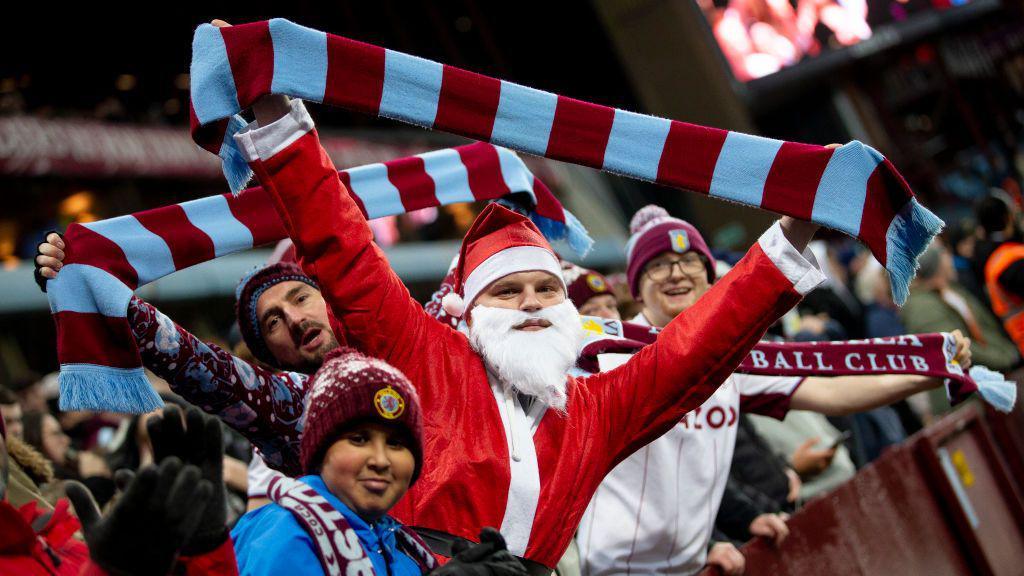 Aston Villa fans dress as Santa for a past festive fixture