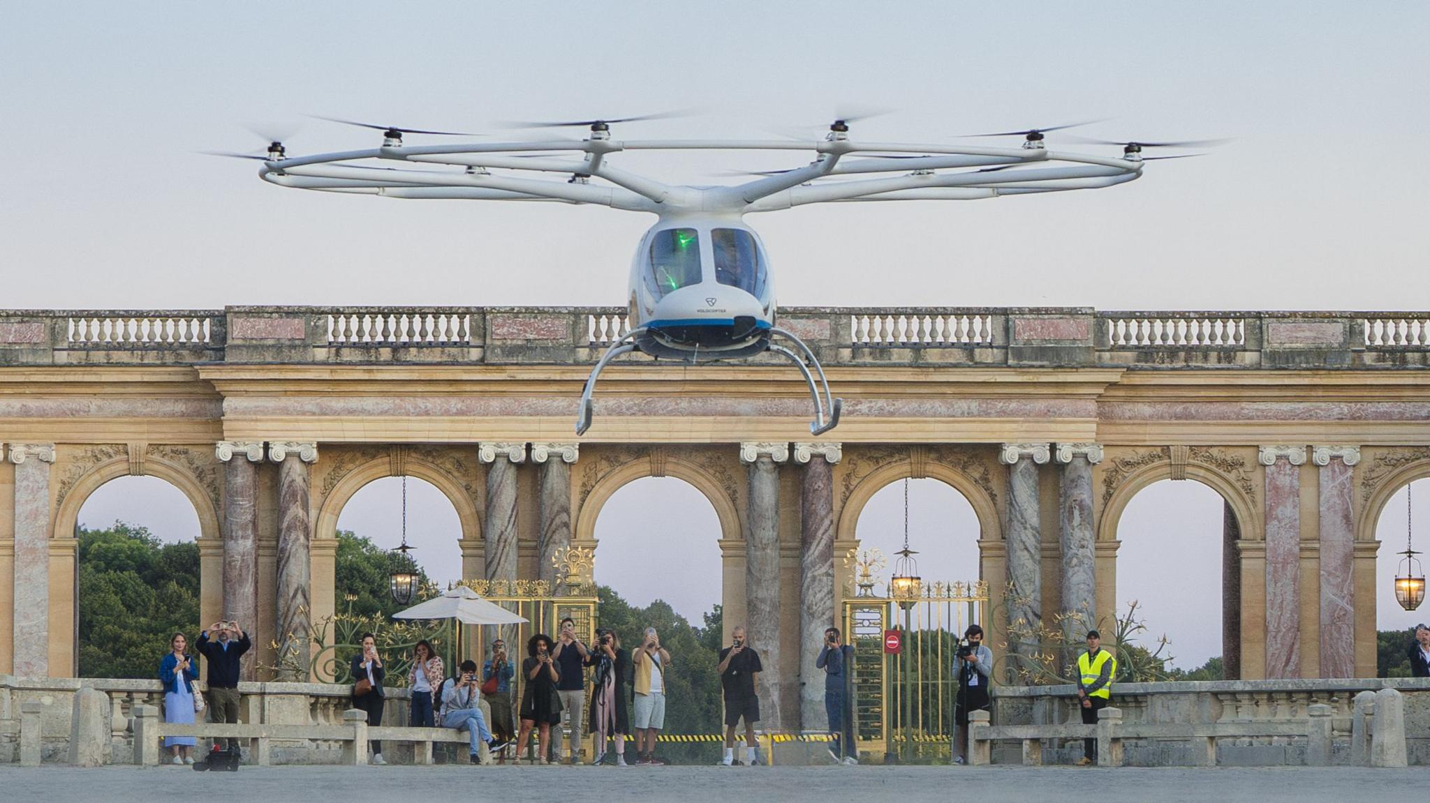 Resembling a large drone, the two-seater VoloCity aircraft takes off at the Palace of Versaille