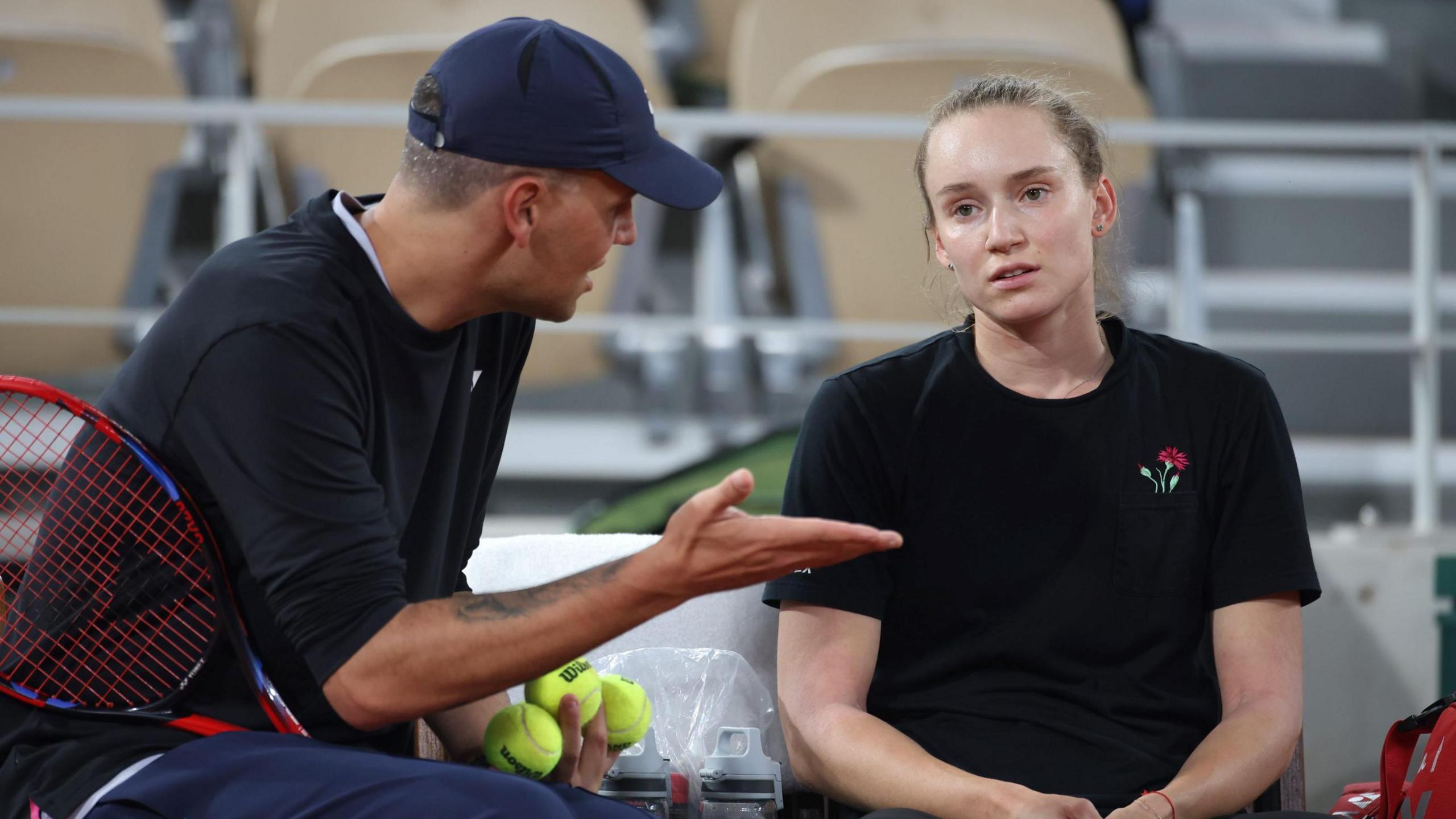 Elena Rybakina listens to coach Stefano Vukov during practice at the 2024 French Open 