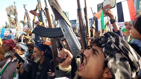 Armed Houthi supporters take part in a protest against Israel and the US in Sanaa, Yemen (27 December 2024)