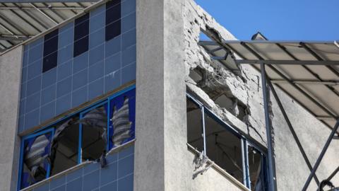 Damaged top floor of a building at al-Ahli hospital in Gaza City, northern Gaza (29 December 2024)