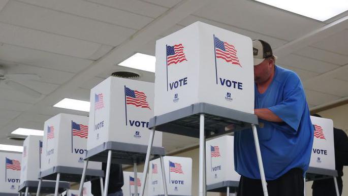 Wisconsin voters cast their ballots at the American Legion Hall on 5th November