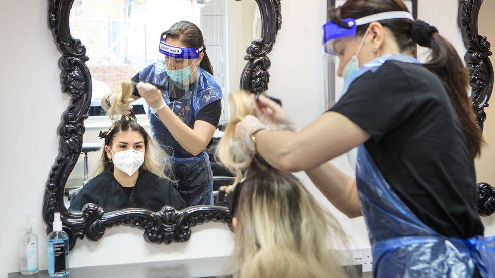 A client and hairdresser at a salon in Leeds