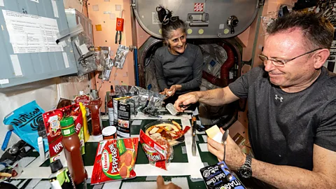 Astronauts eating pizza on the ISS (Credit: Nasa/Esa)