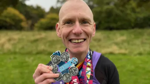 Andy Tomlinson took 938 days to complete the six World Marathon Majors - Berlin, New York City, Boston, Chicago, Tokyo and London