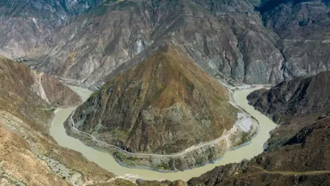 Getty Images A spectacular bend in the Jinsha river as it winds all the way around mountain, is seen in an aerial photo of Garze city, Sichuan Province.