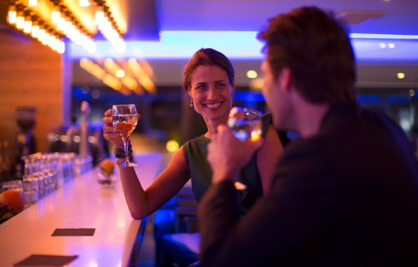 Couple drinking wine in a hotel bar