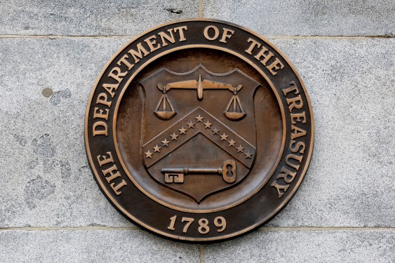 Seal of the U.S. Treasury logo on the wall of the Treasury building in DC