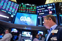 Traders work on the floor at the New York Stock Exchange (NYSE) in New York City, U.S., December 2, 2024.