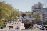 The coat of arms of Transdniestria is depicted on a banner in central Tiraspol, in Moldova's breakaway region of Transdniestria May 5, 2022. REUTERS/Vladislav Bachev