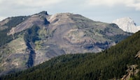 Grassy Mountain, peak to left, and the Grassy Mountain Coal Project are seen north of Blairmore, Alta., Thursday, June 6, 2024. THE CANADIAN PRESS/Jeff McIntosh