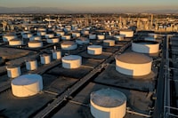 FILE PHOTO: Storage tanks are seen at Marathon Petroleum's Los Angeles Refinery, which processes domestic & imported crude oil in Carson, California, U.S., March 11, 2022. REUTERS/Bing Guan/File Photo