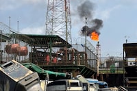 Gas flares from an oil terminal in Niger Delta near the village of Ogboinbiri, Nigeria, Wednesday, Dec. 11, 2024. (AP Photo/Sunday Alamba)