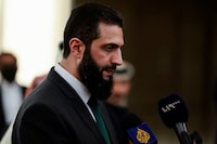 Syria's de facto leader Ahmed al-Sharaa, also known as Abu Mohammed al-Golani, speaks to the media on the day he meets with Qatar's Minister of State Mohammed bin Abdulaziz Al-Khulaifi, after the ousting of Syria's Bashar al-Assad, in Damascus, Syria, December 23, 2024. REUTERS/Ammar Awad/File Photo