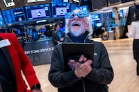 Traders work on the floor of the New York Stock Exchange (NYSE) on the last day of trading for the year on December 31, 2024 in New York City.