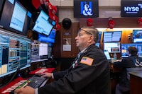 Traders work on the floor of the New York Stock Exchange (NYSE) on the first day of trading of the new year on January 02, 2025 in New York City.