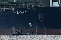 Finnish Coast Guard stops a small boat which tried to reach the oil tanker Eagle S anchored near the Kilpilahti port in Porvoo, on the Gulf of Finland December 30, 2024.  Lehtikuva/Jussi Nukari/via REUTERS