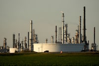 A motorist drives past the CHS oil refinery Saturday, Sept. 28, 2024, in McPherson, Kan. (AP Photo/Charlie Riedel)