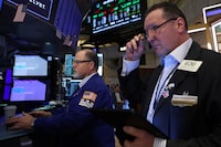 Traders work on the floor at the New York Stock Exchange (NYSE) in New York City, U.S., December 10, 2024.