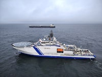 Finnish Border Guard's ship Turva and oil tanker Eagle S sail on the sea outside the Porkkalanniemi, Finland on December 26, 2024. RAJAVARTIOSTO-Finnish Border Guard/LEHTIKUVA/HANDOUT via REUTERS.  ATTENTION EDITORS - THIS IMAGE WAS PROVIDED BY A THIRD PARTY. NO THIRD PARTY SALES. NOT FOR USE BY REUTERS THIRD PARTY DISTRIBUTORS. FINLAND OUT. NO COMMERCIAL OR EDITORIAL SALES IN FINLAND.