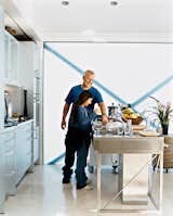 Designer John Picard isn’t afraid of getting his hands dirty in the kitchen, or washing the sand off his feet in the bathroom. This ecological pioneer’s half-lot home is designed for maximum efficiency—and comfort. Opening onto the open-plan living and dining rooms, the aluminum Bulthaup System 20 kitchen with its nine-foot-long stainless steel island and Miele appliances has become a focal point of the house. Pressed in one seamless sheet of steel, the island, Picard says with the obvious pride of a satisfied customer, "is an amazing piece of engineering."