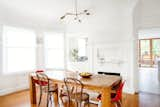 Three furniture icons, in pairs, surround the dining room table: the Eames Side, Thonet No. 14, and Peter Opsvik Tripp Trapp chairs.