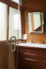 The master bathroom features custom mahogany cabinets and a Caesarstone countertop.