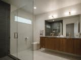 The master bath includes a floating double-vanity, teak cabinets, and an oversized shower.