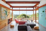 A vintage Kartell table and seating fills the living area.