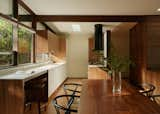 Architect Nahoko Ueda and the homeowners chose a Space Theory kitchen with a combination of white laminate and walnut cabinetry.