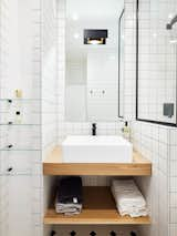 "I optimized every inch of space in the bathroom," says Petillaut, who employed a black-and-white palette and geometric lines that make the room feel more voluminous. 