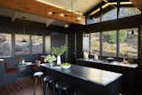 The kitchen was the only room which received a slightly altered layout. In addition wood boards from demolished cabinets were reused to create new cabinet fronts hung on brass piano hinges. The result is a mix of period-appropriate additions and new configurations with recycled parts.