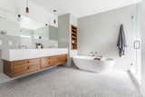 The bathroom features a Brizo Odin shower system and California Faucets. Object & Light pendants hang over the vanity cabinet, and the cabinet drawers are fitted with Made Measure leather tabs.